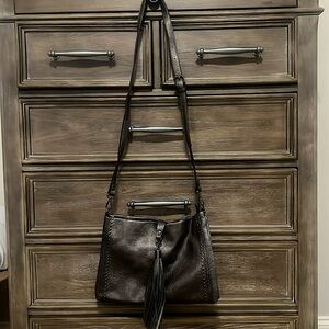 Pewter studded purse with tassel. Never used.